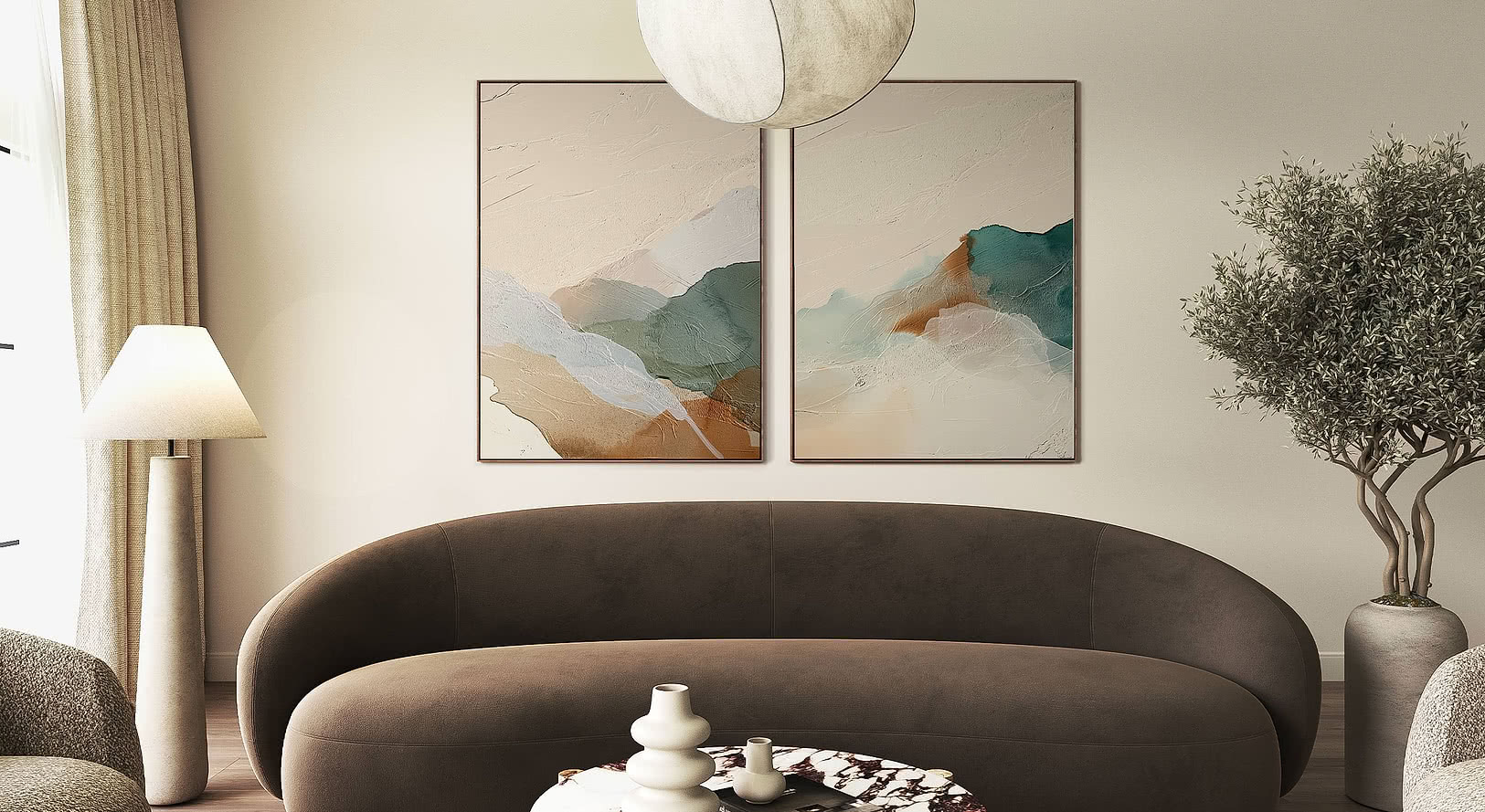Two abstract landscape art prints framed above a curved sofa in a calm, neutral room — large-format wall art for elevating business and hospitality interiors