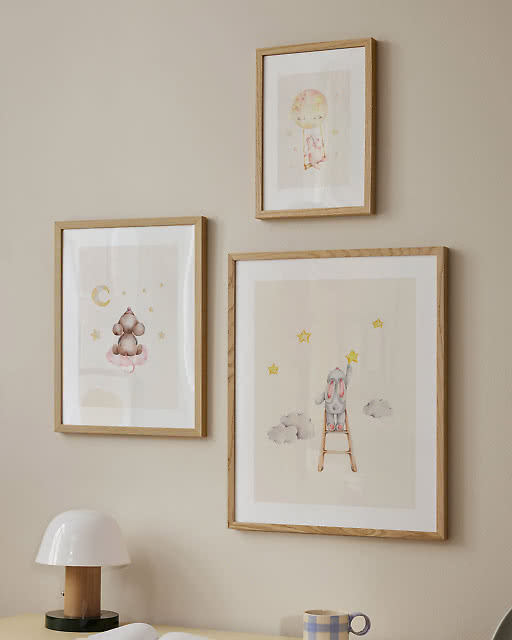 Three soft watercolour prints — a bear among stars, a bunny on a moon balloon, and a rabbit reaching for stars on a ladder.