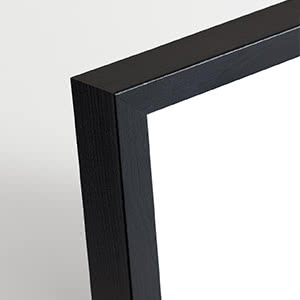 Close-up of a black picture frame corner on a light background