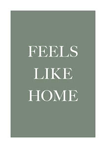 Green poster with white text reading “FEELS LIKE HOME”
