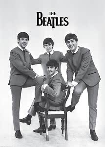 Black-and-white poster of The Beatles in suits, three standing and one seated on a chair