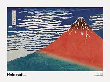 Hokusai woodblock print of red Mount Fuji beneath a blue sky with white clouds