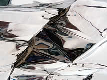 Close-up of crumpled silver reflective foil