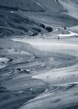 Abstract pattern in grey and blue tones with a fluid marbled effect