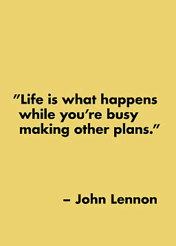 Typographic poster with John Lennon quote in black text on a mustard yellow background.