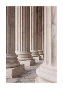 Row of fluted marble columns in light beige and gray tones