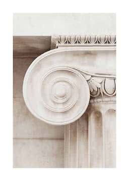 Close-up of a white classical column capital with scrolls and carved details