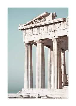 Close-up of an ancient Greek temple with marble columns against a clear blue sky