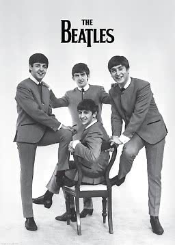 Black-and-white poster of The Beatles in suits, three standing and one seated on a chair