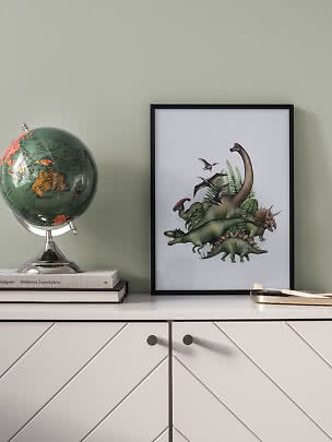 Framed dinosaur poster on a cabinet beside a globe.