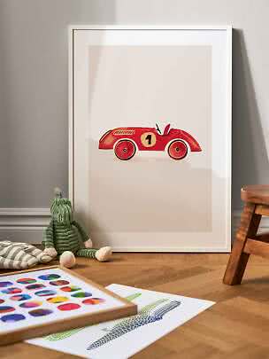 Framed poster of a red race car with number 1, leaning against the wall in a child's room