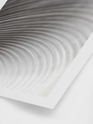 Abstract wall art with gray wave pattern in a white frame