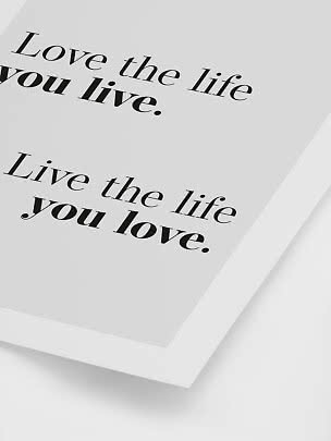 White framed typography poster with the quote "Live the life you love."