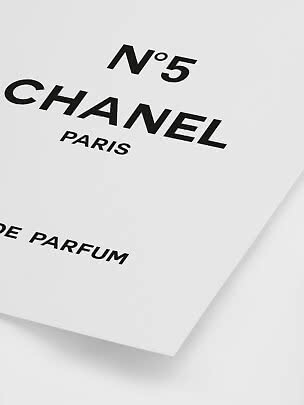 Close-up of white Chanel No. 5 perfume box with black logo