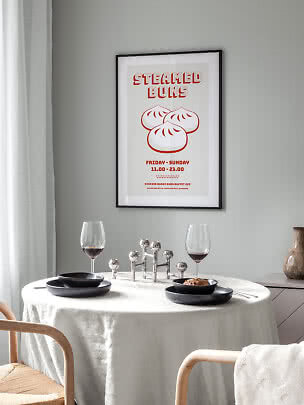 Poster incorniciato con bao al vapore sopra una tavola apparecchiata