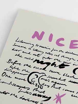 Close-up of art print with black handwritten text, pink letters and a small pink flower on cream background