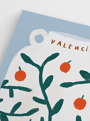 Close-up of poster with green branches, orange fruit and the word Valencia on a light blue background