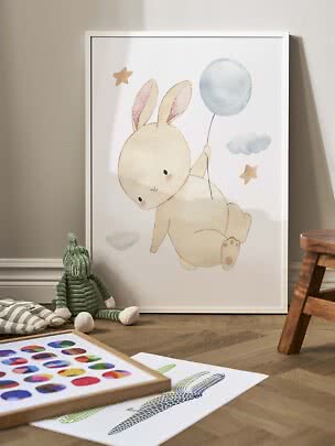 Framed nursery poster of a bunny holding a blue balloon, with clouds and stars