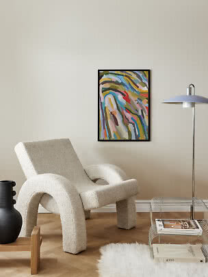 Modern living room with cream lounge chair, abstract painting, floor lamp and low metal side table