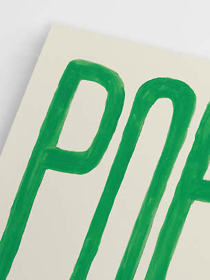 Close-up of poster with hand-painted green letters on a cream background