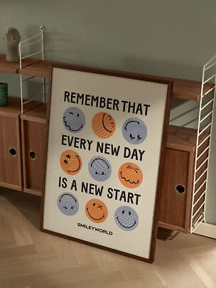 Framed SmileyWorld poster with colorful smiley faces and motivational quote