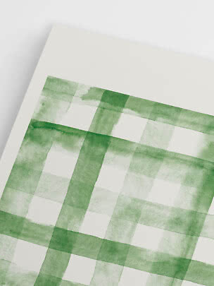 Close-up van wit papier met groen aquarel ruitpatroon.