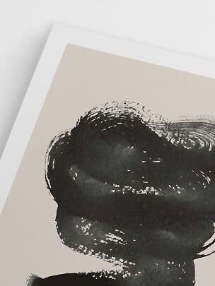Close-up of abstract black brushstroke on beige poster with white border