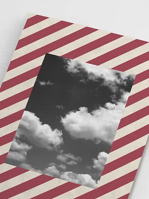 Black-and-white cloud print on a red and cream diagonal striped background