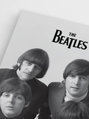Black-and-white poster of The Beatles with the band name at the top