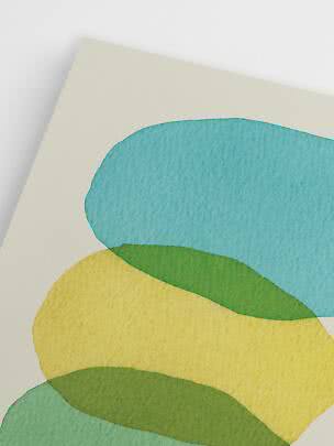 Abstract print with organic blue, green and yellow shapes on a light background