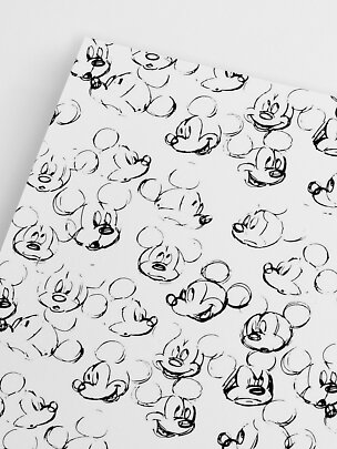 Weißes Blatt mit schwarzem Muster aus Mickey-Mouse-Gesichtern im Skizzenstil