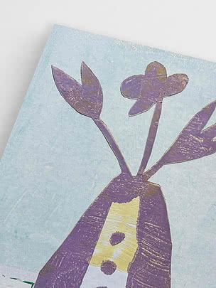 Angled close-up of the unframed print showing the scissor cut petal edges, the brush marks beneath and the pale blue