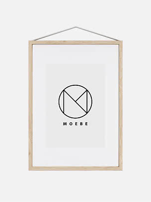 Light wood frame with white mat and MOEBE logo, hanging from a cord