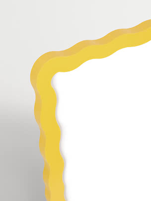 Abstract mirror with wavy yellow frame on a light background