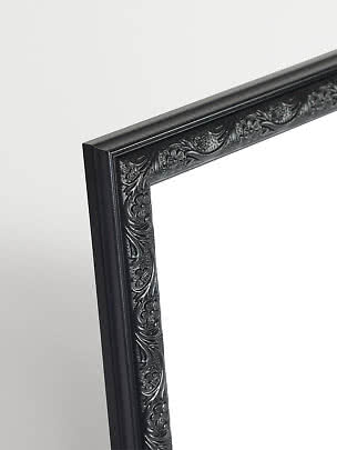 Close-up of black Versailles picture frame with ornate floral detailing.