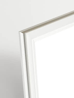 Close-up of white Madeleine picture frame with profiled edge