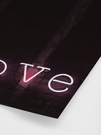Pink neon letters on a dark wooden ceiling, viewed from below