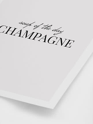 Hvid typografiplakat med teksten "soup of the day CHAMPAGNE" i sort