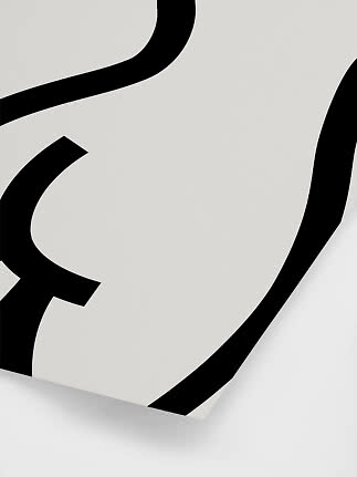 Abstract black line art on a white poster, shown at an angle