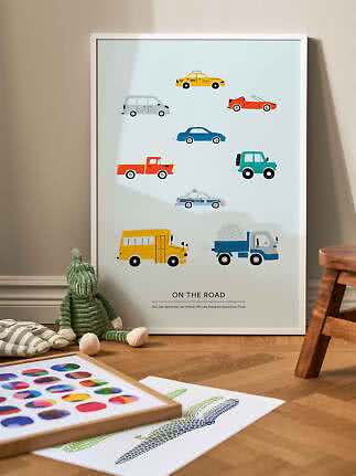 Framed children's poster with colorful cars and trucks on a light blue background
