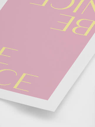 Pink poster or book cover with yellow letters on a white surface