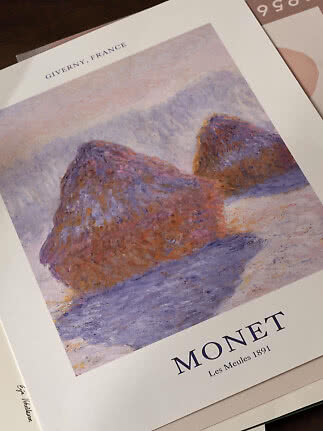 Monet art print with impressionist haystacks in purple and pink tones