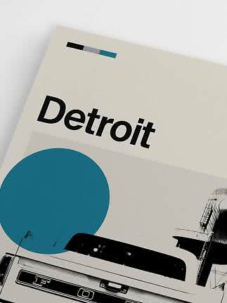 Close-up of Detroit poster with bold black text, blue circle and black-and-white car graphic