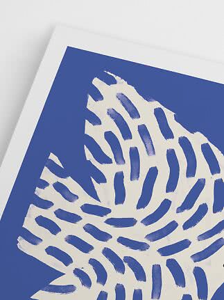 Close-up of a blue and white abstract print with a leaf-like pattern