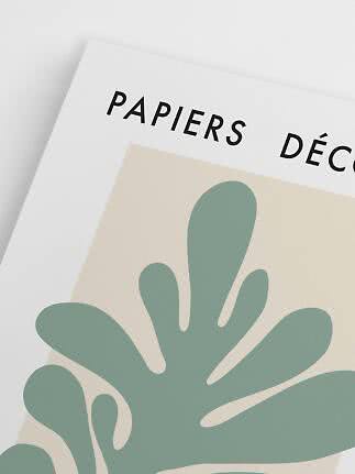 Nærbillede af kunstplakat med grøn abstrakt bladform og teksten "PAPIERS DÉCO"
