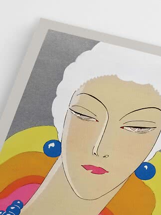 Close-up of art print with stylized female portrait, white hair, blue earrings, and colorful shapes
