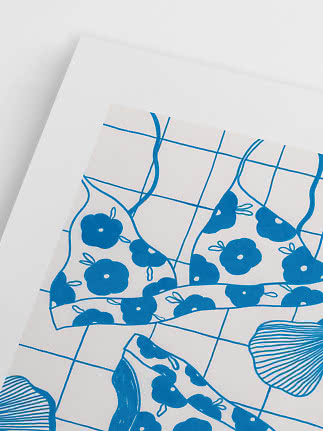 Blue and white illustration of floral bikini pieces on a checkered background