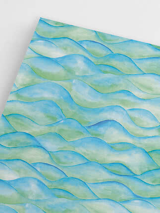 Sheet with blue and green watercolor wave pattern on a white background