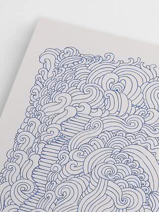 Close-up of poster with blue abstract wave patterns on a white background