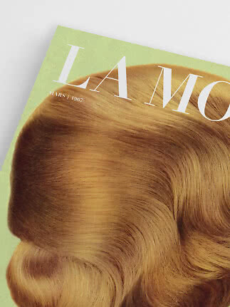Close-up of magazine cover with wavy golden hair and white title on a light green background